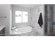 Updated bathroom with soaking tub and walk-in shower at 7331 E Valley Vista Dr, Scottsdale, AZ 85250