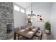 Dining room with a chandelier, wood table, and view of the kitchen at 7331 E Valley Vista Dr, Scottsdale, AZ 85250