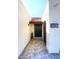 Front entry with dark brown wood door and tile floor at 7331 E Valley Vista Dr, Scottsdale, AZ 85250