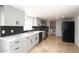 Modern kitchen with gray cabinets, marble counters, and herringbone backsplash at 7331 E Valley Vista Dr, Scottsdale, AZ 85250