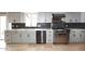Modern kitchen featuring stainless steel appliances and gray cabinetry at 7331 E Valley Vista Dr, Scottsdale, AZ 85250