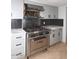 Stainless steel range and gray shaker cabinets in this updated kitchen at 7331 E Valley Vista Dr, Scottsdale, AZ 85250