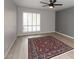 Living room with ceiling fan and area rug at 7331 E Valley Vista Dr, Scottsdale, AZ 85250