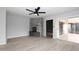 Living room with a stone fireplace and sliding glass doors at 7331 E Valley Vista Dr, Scottsdale, AZ 85250