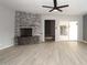 Spacious living room with fireplace, patio access, and ceiling fan at 7331 E Valley Vista Dr, Scottsdale, AZ 85250