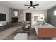Living room with a fireplace, modern furniture, and sliding doors to patio at 7331 E Valley Vista Dr, Scottsdale, AZ 85250