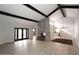 Open living area with a stone fireplace and access to backyard at 7331 E Valley Vista Dr, Scottsdale, AZ 85250