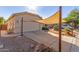 Attached garage with shade structure and desert landscaping at 805 W Sunset Dr, Coolidge, AZ 85128