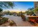 Outdoor kitchen and patio area with desert landscaping at 8595 E Bronco Trl, Scottsdale, AZ 85255