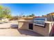 Built-in BBQ grill and prep area for outdoor cooking at 8813 S 13Th Pl, Phoenix, AZ 85042