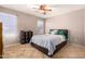 Spacious bedroom with tiled floor and ceiling fan at 8813 S 13Th Pl, Phoenix, AZ 85042