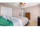 Bedroom with large closet and ceiling fan at 8813 S 13Th Pl, Phoenix, AZ 85042