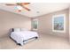 Large bedroom with ceiling fan and comfortable bed at 8813 S 13Th Pl, Phoenix, AZ 85042