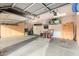 Garage with overhead storage and ample space at 8813 S 13Th Pl, Phoenix, AZ 85042