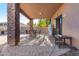 Covered patio with seating area, perfect for outdoor dining at 8813 S 13Th Pl, Phoenix, AZ 85042