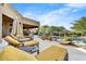 Spacious patio with lounge chairs and a covered seating area at 9378 E Sundance Trl, Scottsdale, AZ 85262