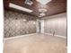 Bright bedroom featuring tile floors and decorative wallpaper at 965 N 87Th Way, Scottsdale, AZ 85257