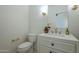 Modern bathroom with white vanity and gold fixtures at 9948 N 119Th Pl, Scottsdale, AZ 85259