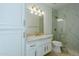 Elegant bathroom with marble shower and modern vanity at 9948 N 119Th Pl, Scottsdale, AZ 85259