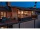 Evening view of a deck overlooking city lights with seating at 1318 E Echo Ln, Phoenix, AZ 85020