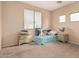 Small bedroom with twin bed and two nightstands at 14654 W Lisbon Ln, Surprise, AZ 85379