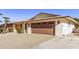 Two-car garage with an attached carport and a spacious driveway at 19607 N Signal Butte Cir, Sun City, AZ 85373