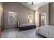 Two bedrooms with tiled floors and ceiling fans at 2606 N 89Th Dr, Phoenix, AZ 85037