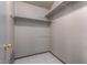 Shelved closet with tile floor and light-colored walls at 2606 N 89Th Dr, Phoenix, AZ 85037