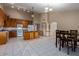 Open kitchen with island, granite countertops, and lots of cabinet space at 2606 N 89Th Dr, Phoenix, AZ 85037