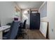 Home office with two desks and a filing cabinet at 2606 N 89Th Dr, Phoenix, AZ 85037