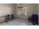 Small office with two chairs and a desk at 2606 N 89Th Dr, Phoenix, AZ 85037