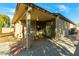 Covered patio with table and chairs at 2606 N 89Th Dr, Phoenix, AZ 85037