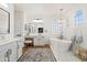 Elegant bathroom with double vanity, soaking tub, and walk-in shower at 2811 E Riviera Pl, Chandler, AZ 85249