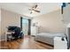 Spacious bedroom with wood floors, large window, and built-in dresser at 2811 E Riviera Pl, Chandler, AZ 85249