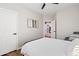 Bedroom with a queen-size bed and an open door to another room at 2811 E Riviera Pl, Chandler, AZ 85249