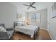 Bright bedroom with a metal bed frame, wood floors, and a ceiling fan at 2811 E Riviera Pl, Chandler, AZ 85249