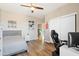 Bright bedroom with wood floors and a view into another room at 2811 E Riviera Pl, Chandler, AZ 85249