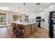 Modern kitchen with large island, white cabinets, and quartz countertops at 2811 E Riviera Pl, Chandler, AZ 85249