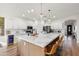 Modern kitchen with large island, white cabinets, and quartz countertops at 2811 E Riviera Pl, Chandler, AZ 85249