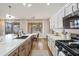 Modern kitchen with large island, white cabinets, and quartz countertops at 2811 E Riviera Pl, Chandler, AZ 85249