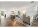 Open concept living and dining area with hardwood floors and neutral decor at 2811 E Riviera Pl, Chandler, AZ 85249