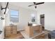 Home office with wood floors and built-in desk and cabinets at 2811 E Riviera Pl, Chandler, AZ 85249