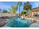 Inviting backyard pool with spacious patio and palm trees at 2811 E Riviera Pl, Chandler, AZ 85249