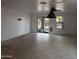 Living room with tile flooring, white walls, a ceiling fan, and sliding glass doors to the backyard at 3210 W Saint Catherine Ave, Phoenix, AZ 85041