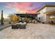 Outdoor kitchen, fire pit, and seating area with house view at 33014 N 53Rd Pl, Cave Creek, AZ 85331