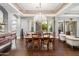 Elegant dining room features a large wooden table, chandelier, and hardwood floors at 33014 N 53Rd Pl, Cave Creek, AZ 85331