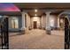 Inviting front entry with brick pavers and elegant columns at 33014 N 53Rd Pl, Cave Creek, AZ 85331