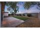 Backyard with artificial turf, fire pit, and a covered patio at 3502 E Janice Way, Phoenix, AZ 85032