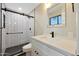 Modern bathroom with subway tile, a glass shower, and white vanity at 3502 E Janice Way, Phoenix, AZ 85032