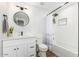 Modern bathroom with white cabinets, a walk-in shower, and hexagon tile at 3502 E Janice Way, Phoenix, AZ 85032